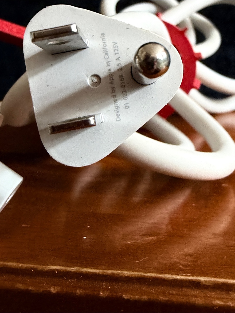 a bundle of 7 white Apple AC Power Adapter Extension Cables.